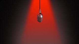 Illustration of a microphone hanging under a red spotlight. 